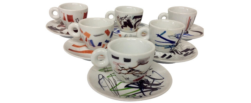 A Collection Of Espresso Cups Designed With Unique Decorative Swirls